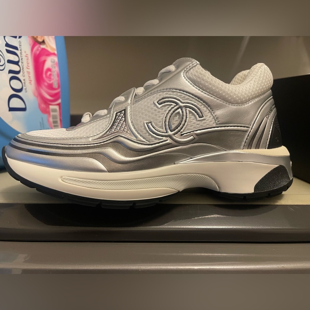 2023 Cruise Chanel Trainers.  Brand new still in box w paperwork. Silver/White